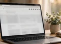 Laptop on a tidy desk showing a web browser with puzzle-piece extension icons in the toolbar