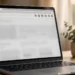 Laptop on a tidy desk showing a web browser with puzzle-piece extension icons in the toolbar